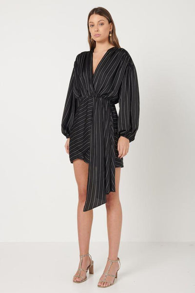 Elliatt Collective Pavilion Mini Dress in black and whilte pinstripe. Long Sleeve Black Mini Dress with Faux wrap skirt and plunge neckline. Long fabric drape dress cocktail race dress and wedding guest outfit.